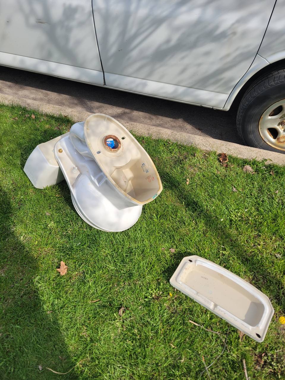 Toilet tanks removed during a toilet replacement service call by Niagara Drain Master